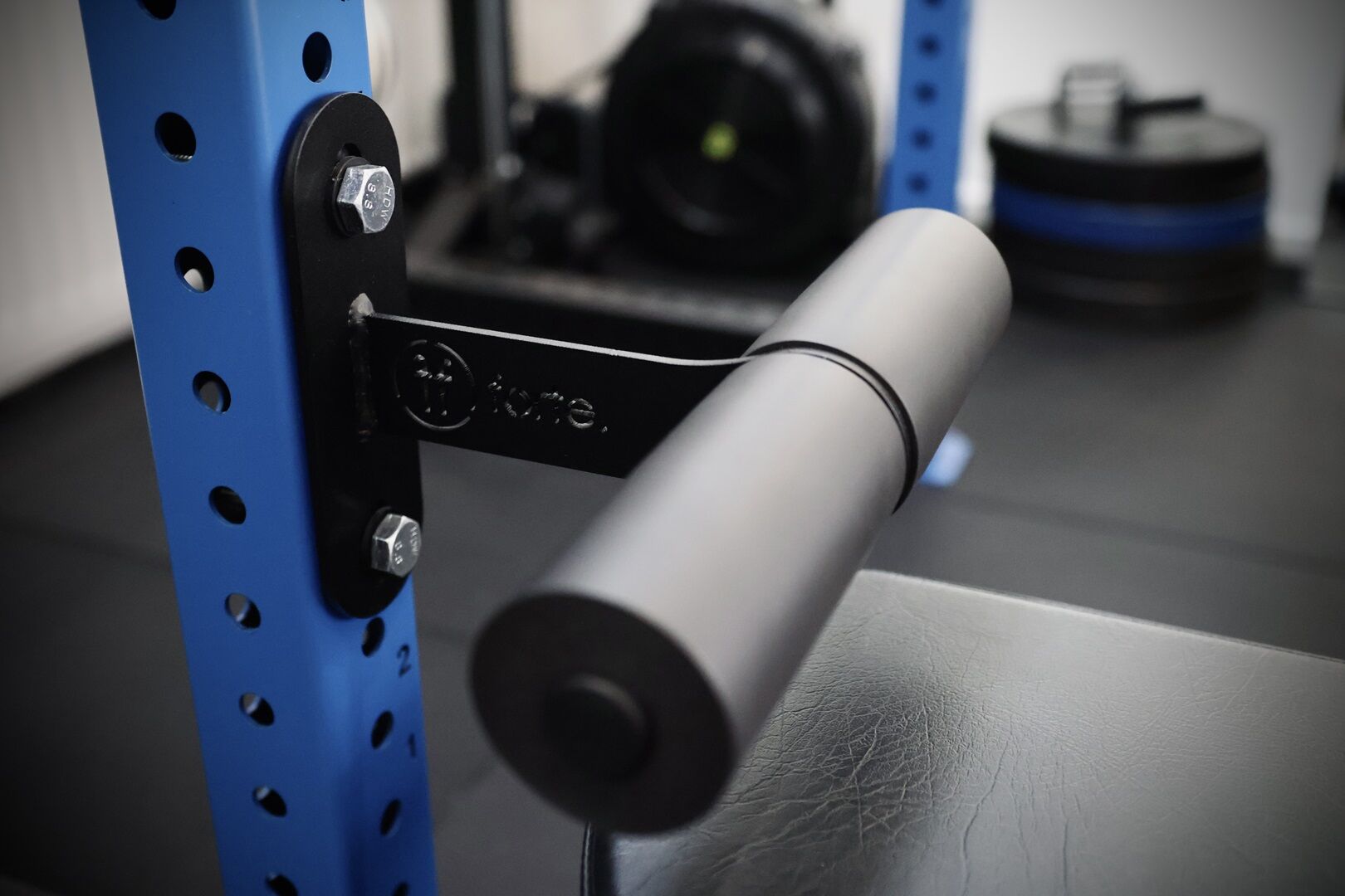 nordic. nordic curl attachment mounted on a blue rack