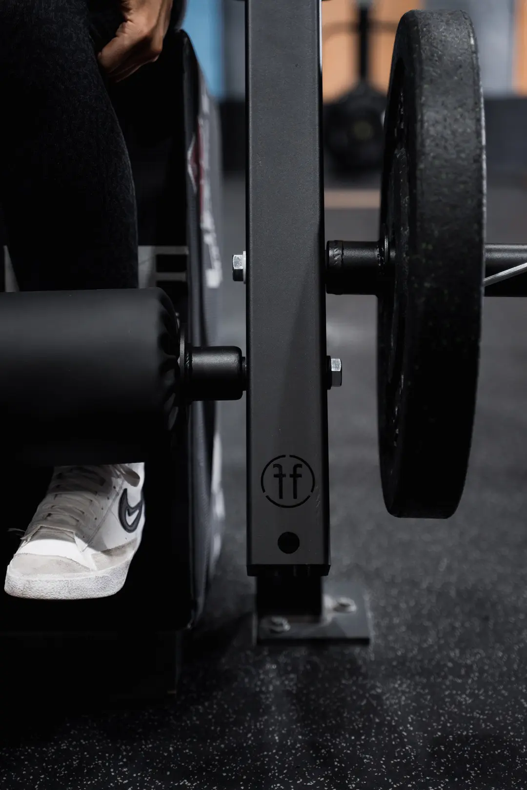 leg extension. A Forte Fitness leg extension attachment in black, with the padded roller displayed at the front of the image.