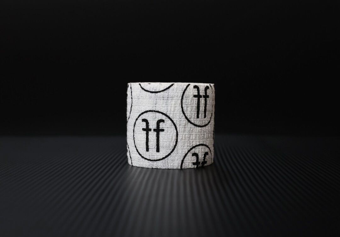 white thumb tape white thumb tape with black FF logo on black background
