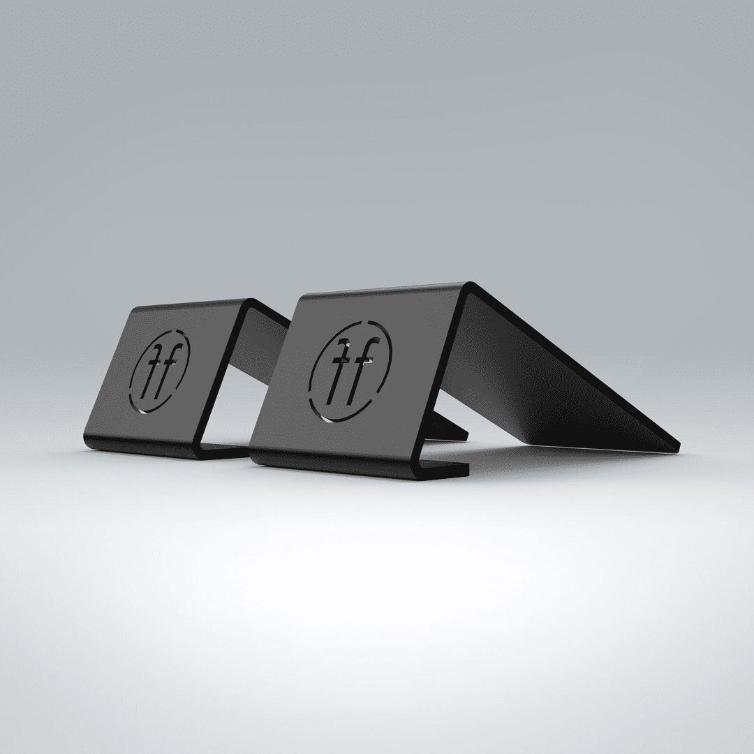 SLANT BLOCKS Two single-footed slant blocks featuring the Forte Fitness logo. The blocks are metal, and are shaped in a slant with a hollow centre.