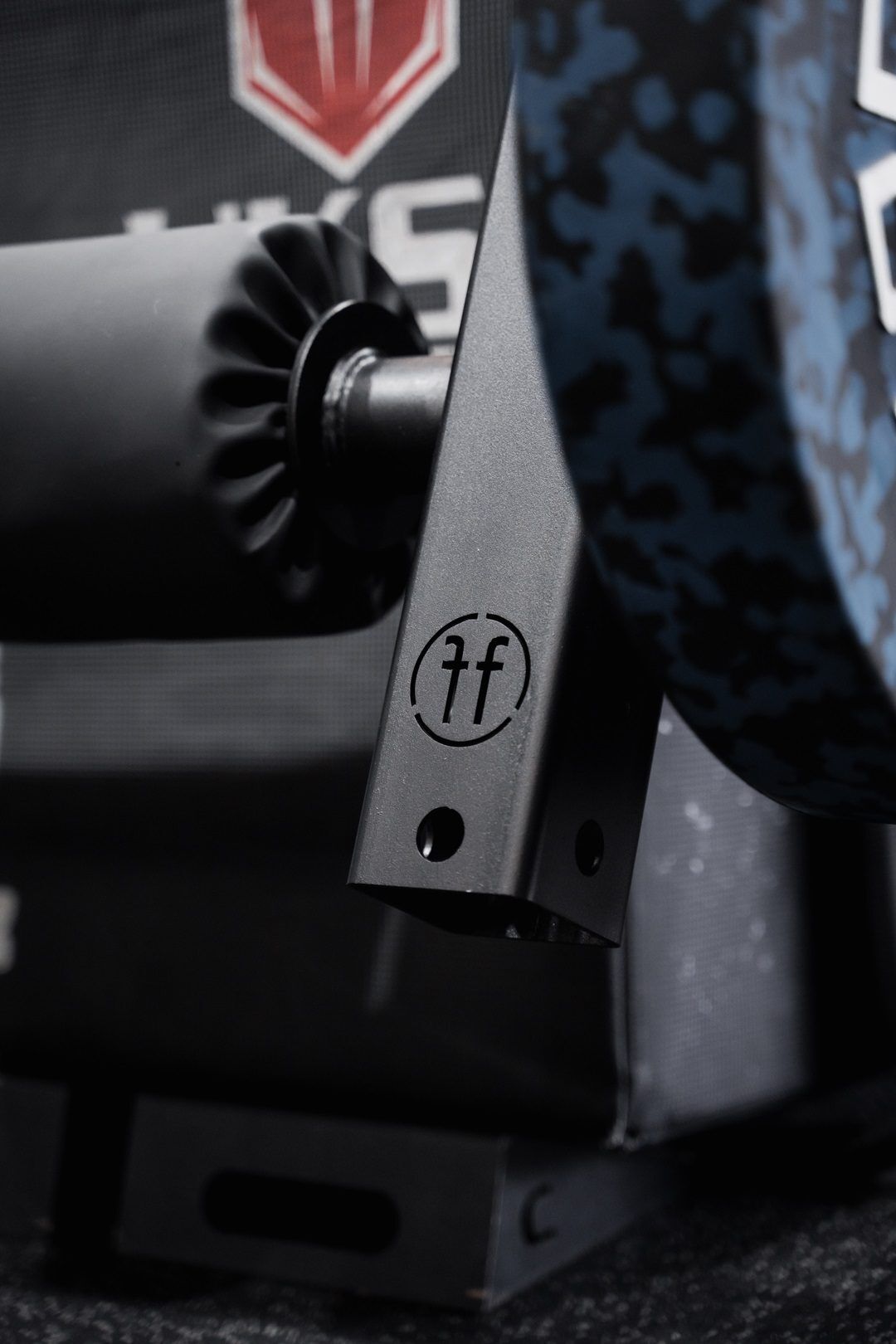 leg extension. A Forte Fitness leg extension attachment in black, with the padded roller displayed at the front of the image.