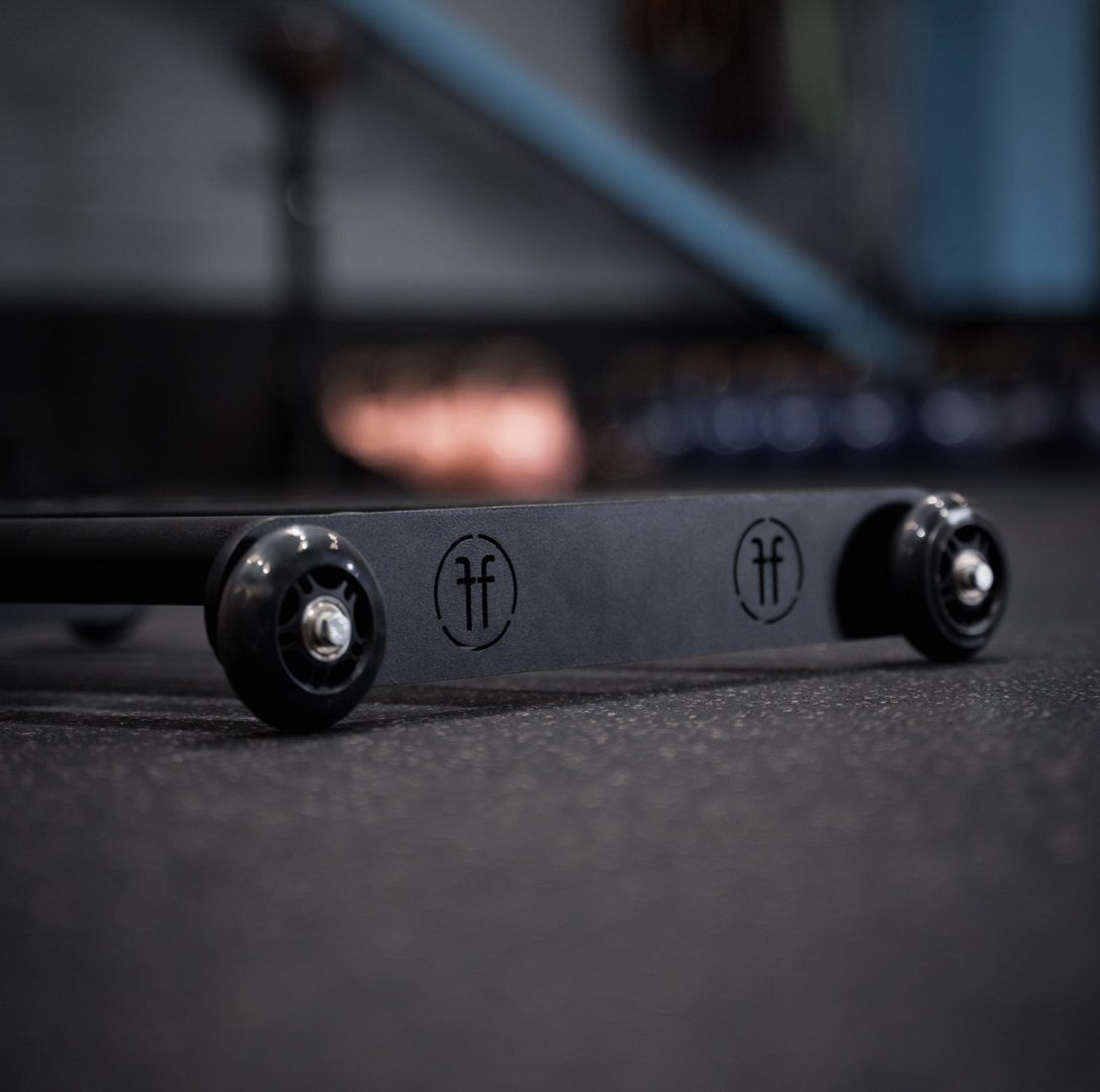 Glute Ham roller Glute ham roller equipment piece on a gym floor showing the Forte Fitness logo