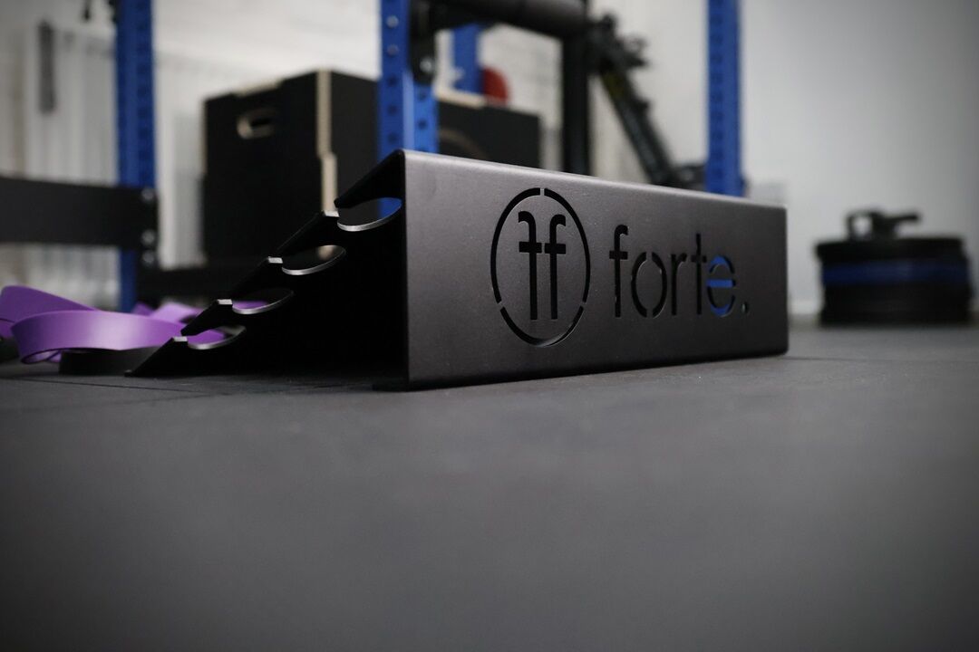 slant resist. slant platform set up in a gym with purple resistance band